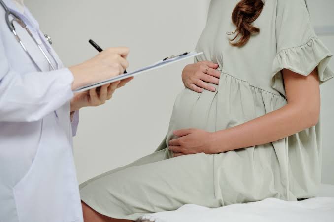Pregnant woman preparing for a healthy pregnancy and delivery with prenatal care
